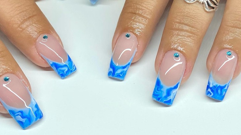 Blue French tips with gem accents