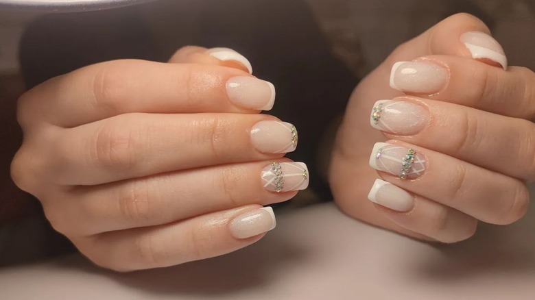 Classic white French tips with stone accents