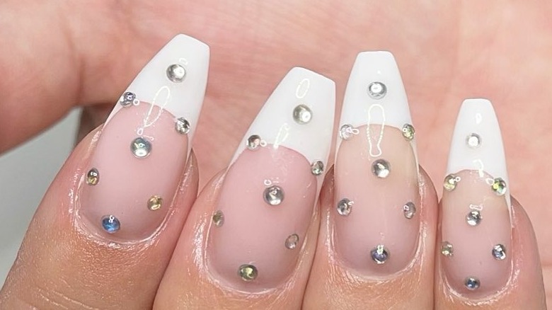 French manicure with several gems