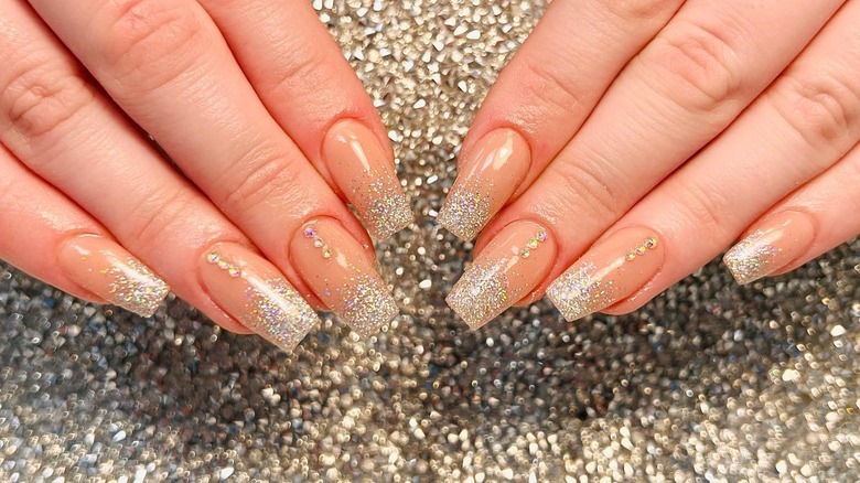 Glittery French tips with a line of gems