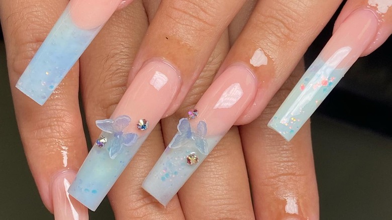 Pastel French tips with gems and butterflies