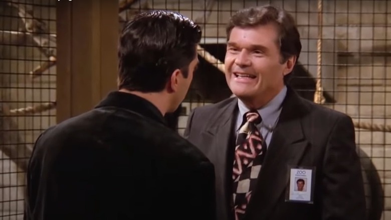 Fred Willard smiling during a scene in Friends 