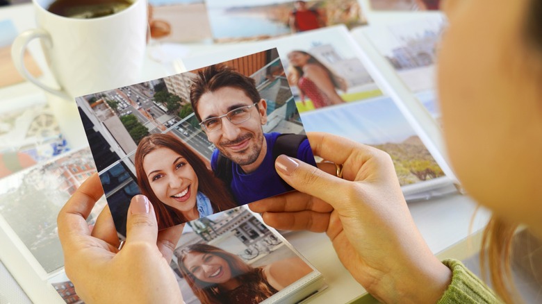 woman holding happy couple photo