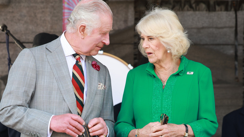 King Charles and Queen Camilla looking at each other