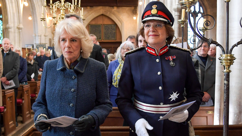 Queen Camilla and Sarah Troughton during church service