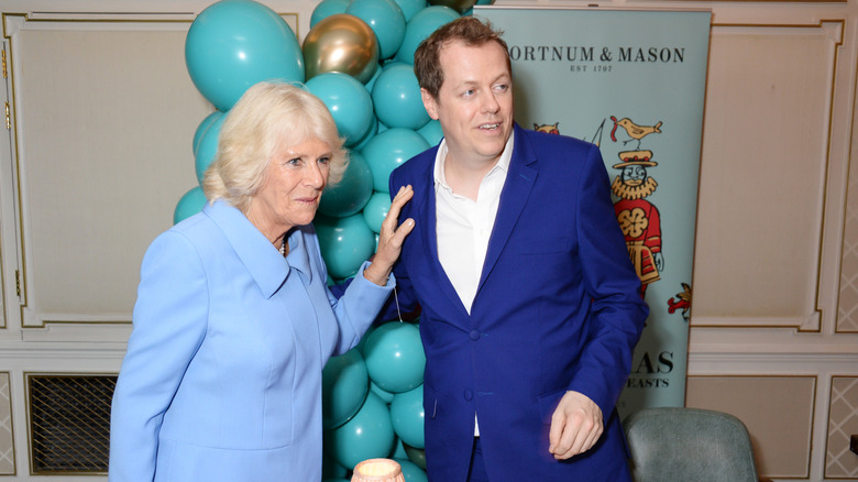 Queen Camilla and Tom Parker Bowles posing 