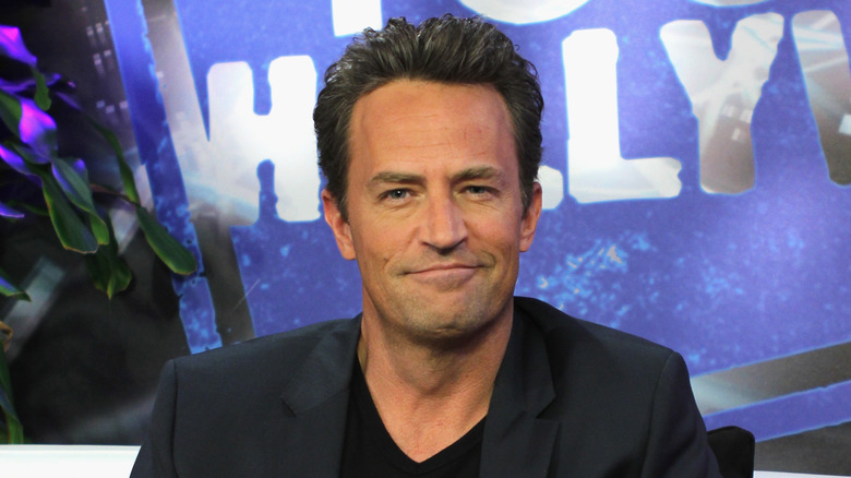 Matthew Perry smirking