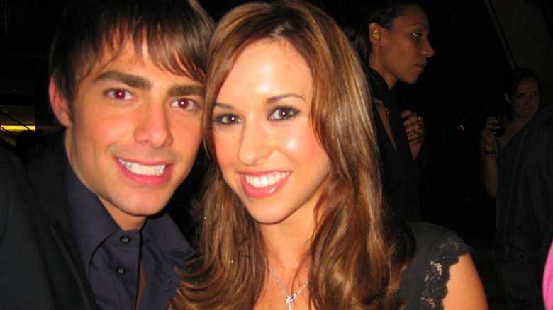 Jonathan Bennett and Lacey Chabert smiling in 2004 while filming "Mean Girls"