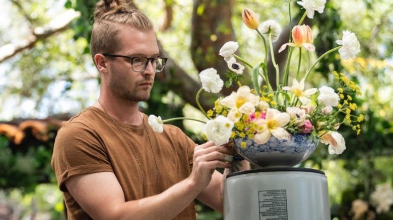 Conner Nesbit arranging flowers