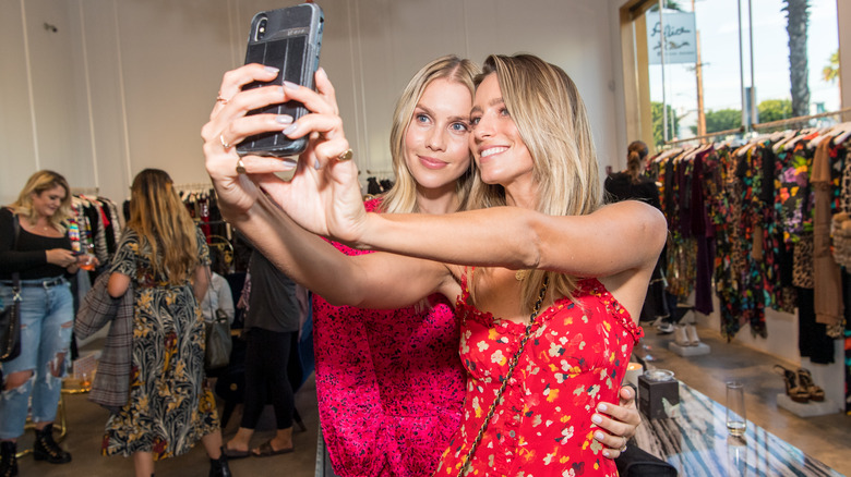 Claire Holt taking a selfie with Renee Bargh