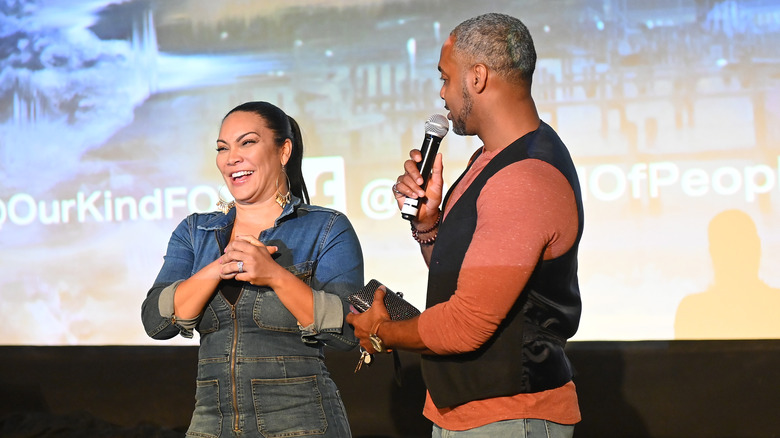 Egypt Sherrod and Mike Jackson laughing on stage