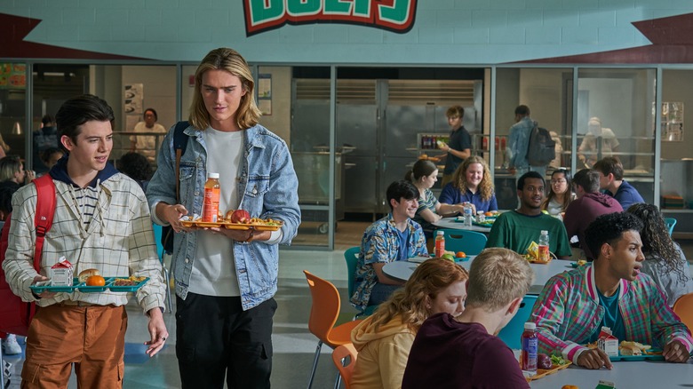 Griffin Gluck and Luke Eisner holding lunch trays in Tall Girl 2