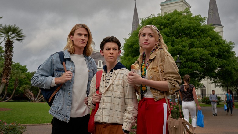 Griffin Gluck standing with his co-stars from Tall Girl 2