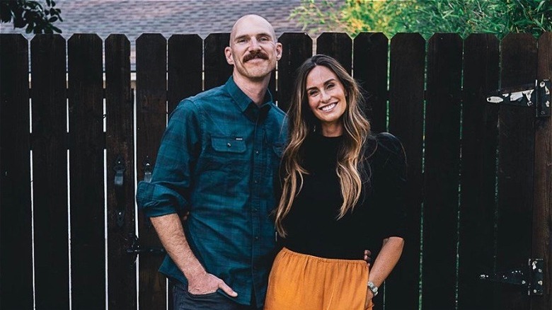 Kim Wolfe smiling with her husband Bryan