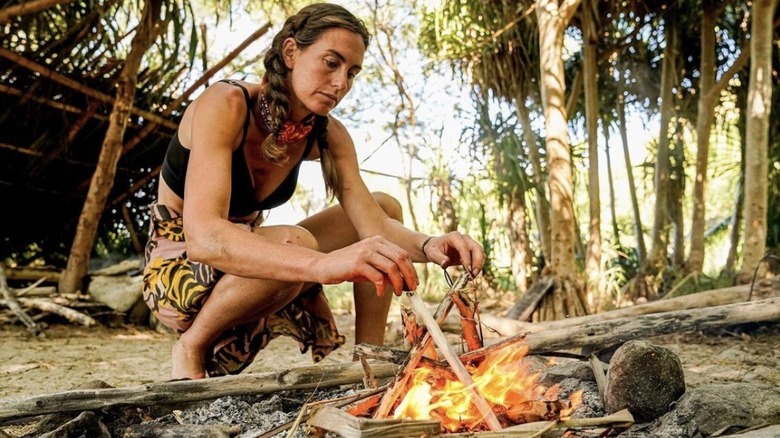 Kim Wolfe building a fire on Survivor