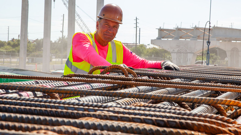 Mike Rowe working with rod busters