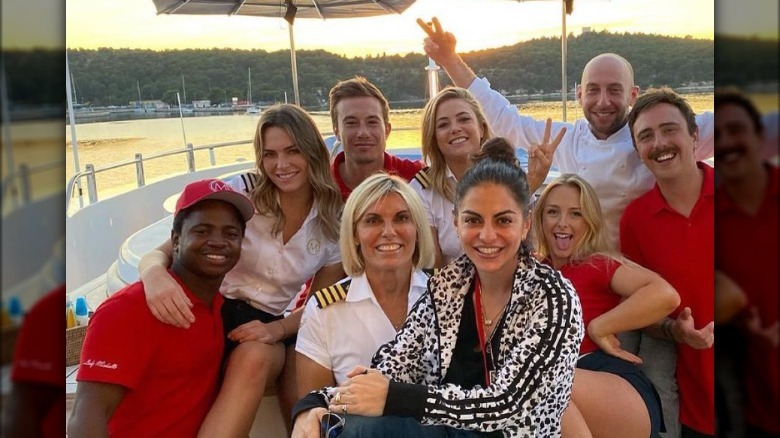 Mzi "Zee" Dempers with Captain Sandy Yawn and the cast of "Below Deck Mediterranean" Season 6