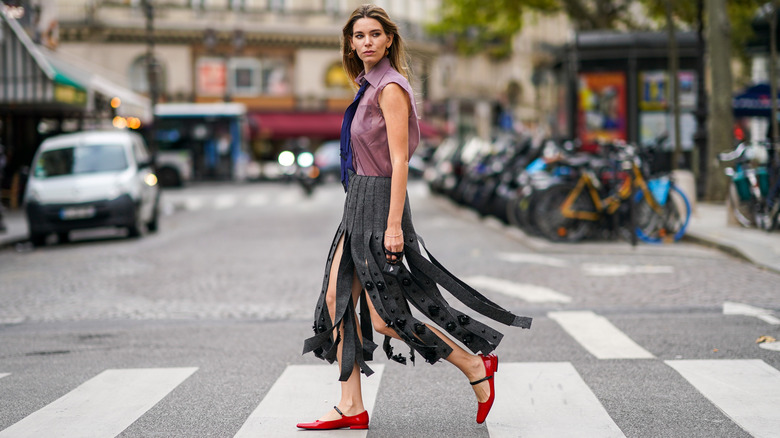 woman in fringe midi skirt