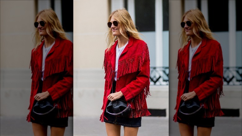 woman in red fringe jacket