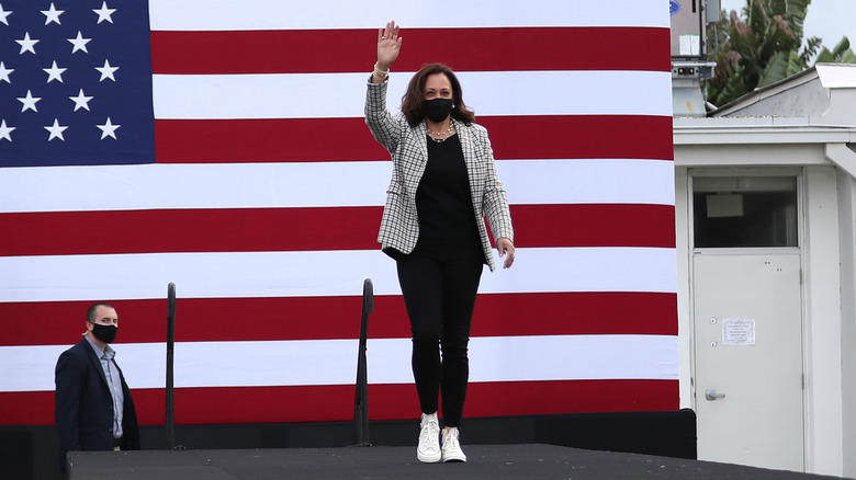 Kamala Harris waving wearing a mask and converse at the Palm Beach State College on October 31, 2020 in Lake Worth, Florida.