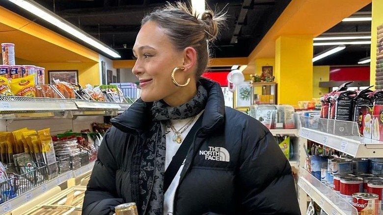 Woman's wearing gold earrings