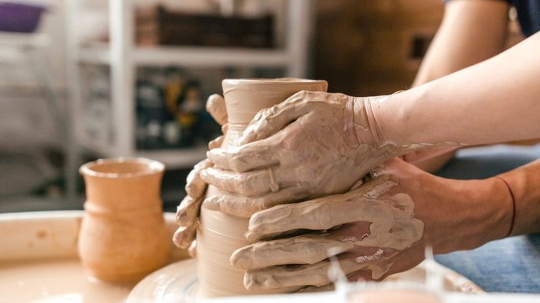 Couple doing pottery together