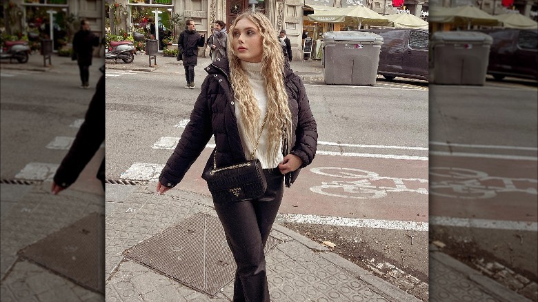 woman in streetwear with black crossbody