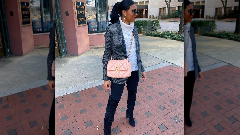 woman in houndstooth blazer and pink crossbody