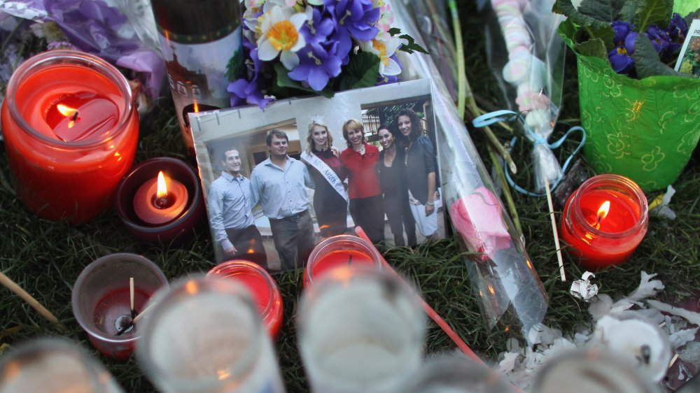 Candles and flowers at the site of the shooting