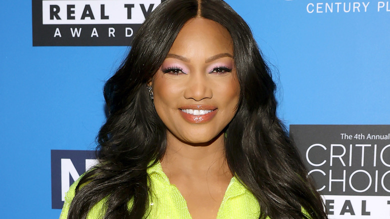 Garcelle Beauvais smiling at The Critics Choice Real TV Awards