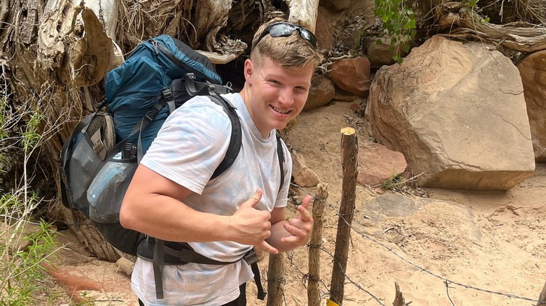 Garrison Brown smiling, wearing backpack