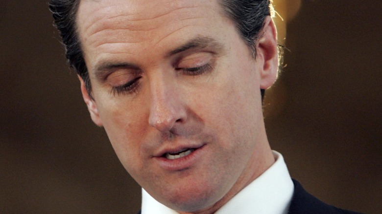 Gavin Newsom looking down