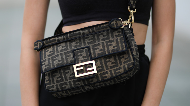 Woman with Fendi baguette bag