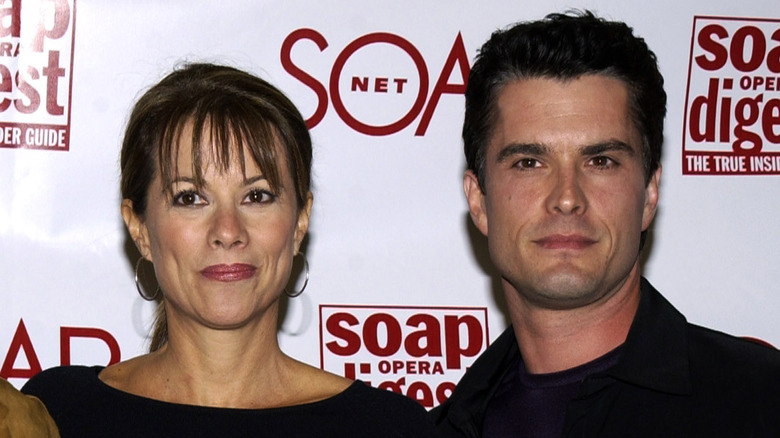 Nancy Lee Grahn and Rick Hearst posing