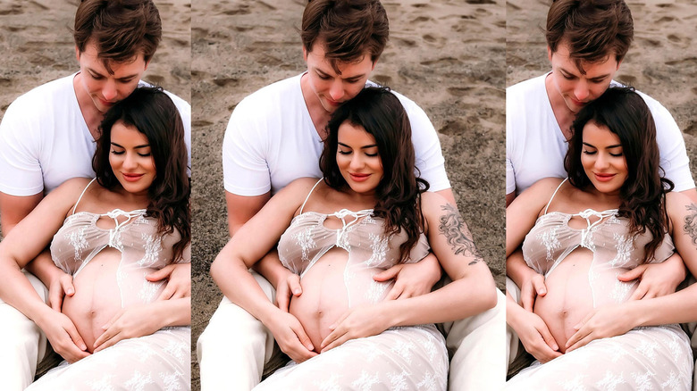 Chad Duell holding Luana Lucci at the beach