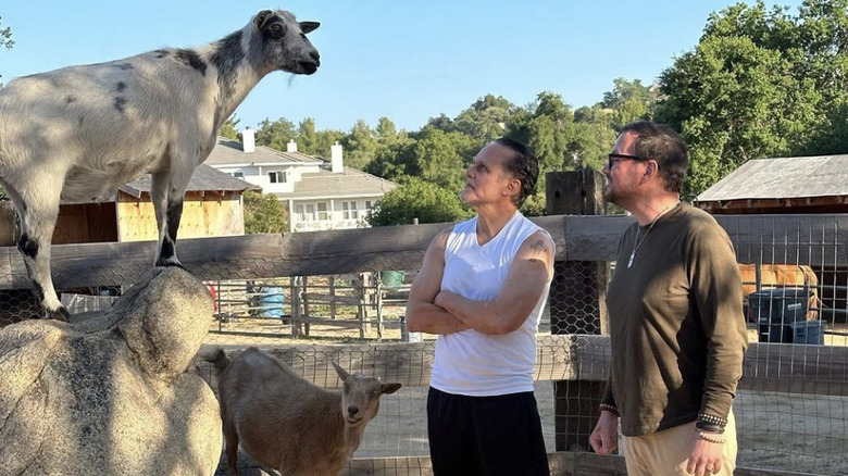 Tyler Christopher and Maurie Benard spending time with goats