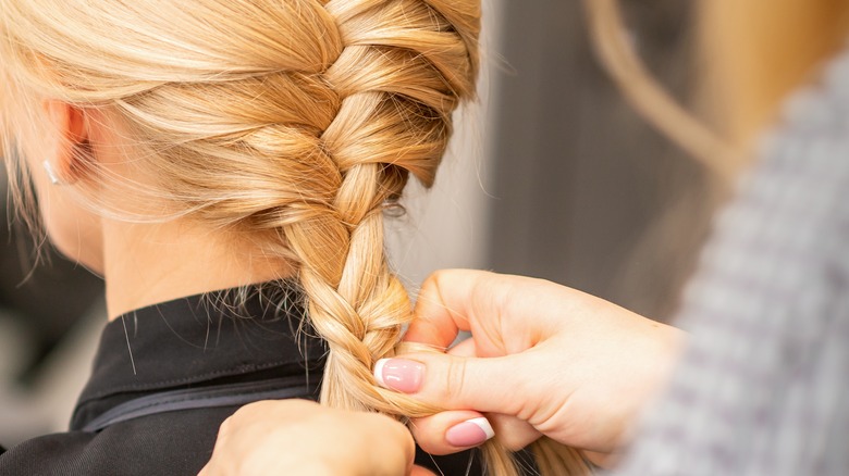 Person braiding hair