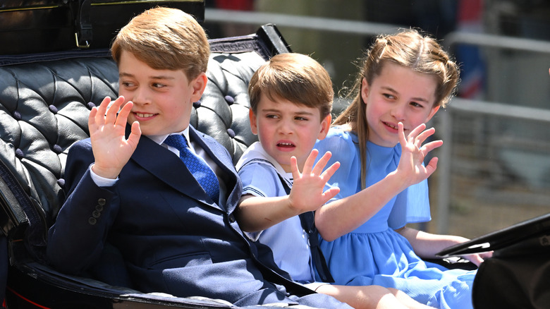 Prince George, Prince Louis, and Princess Charlotte in a carriage