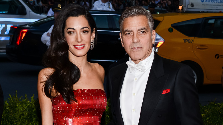 George & Amal Clooney posing