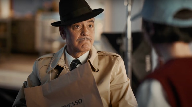 George Clooney holding a bag in Nespresso ad