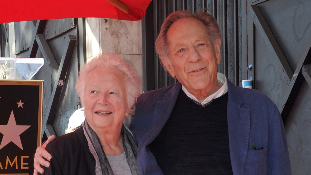 George Segal and wife Sonia smile