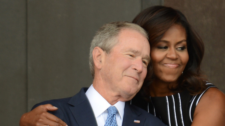 Michelle Obama embracing George W. Bush