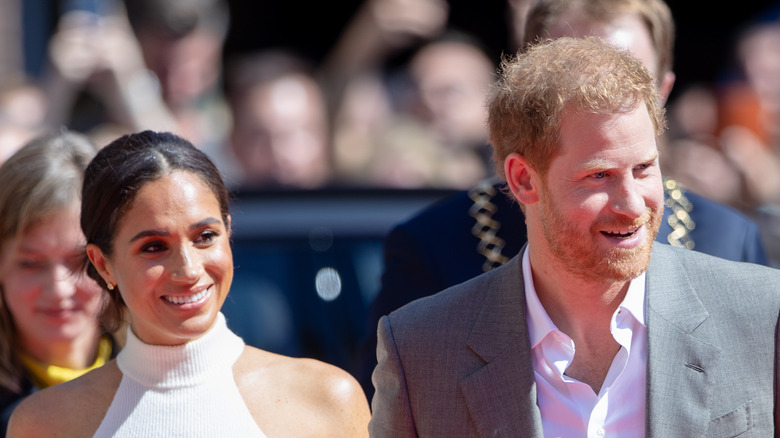 Prince Harry and Meghan Markle exit car Dusseldorf 2022