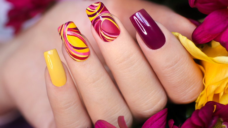 Maroon and yellow gel nails