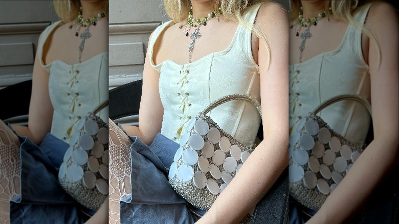 Woman in corset top and statement necklace