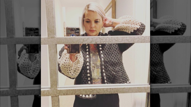 Kirsten Storms wearing a cardigan she made.