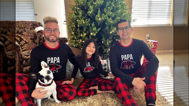 Hannah Rubio with her dads and French bulldog