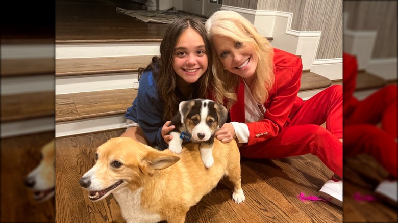 Charlotte and Kellyanne Conway posing with dogs