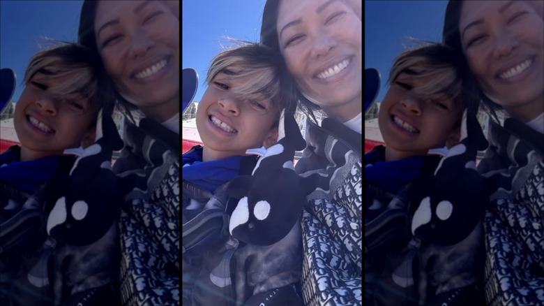 Kimora Lee Simmons and Wolfe in heads-together selfie