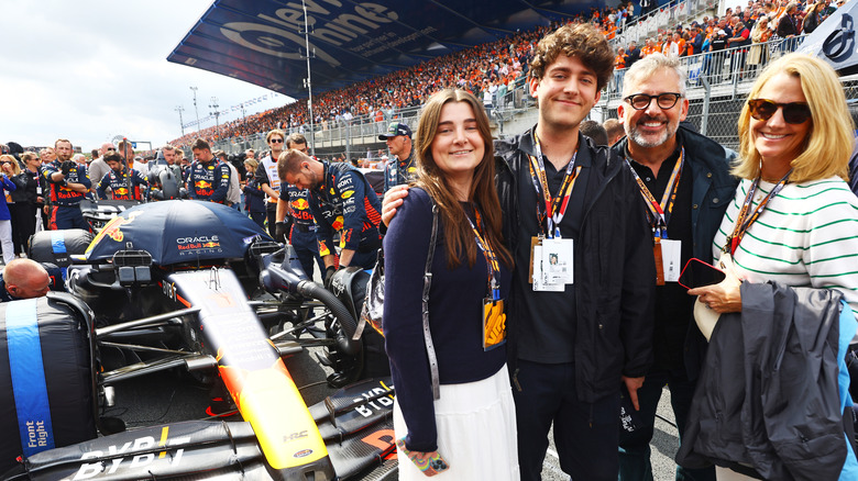 Steve Carell poses with his family at a race car event